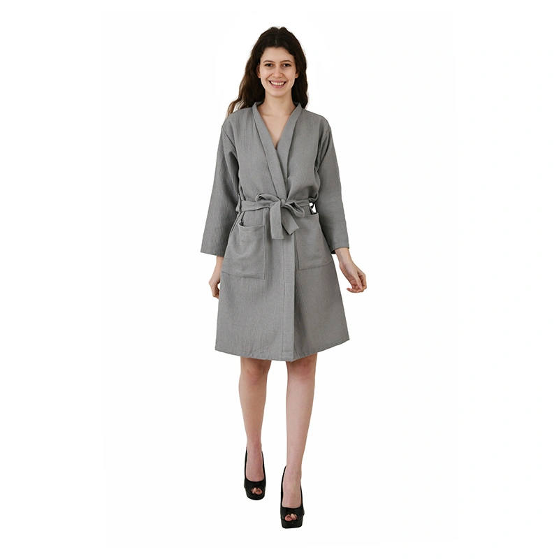 Grey waffle-textured knee-length bathrobe with tie belt, worn with heels - loungewear ecommerce photography by Lohar Studio Delhi